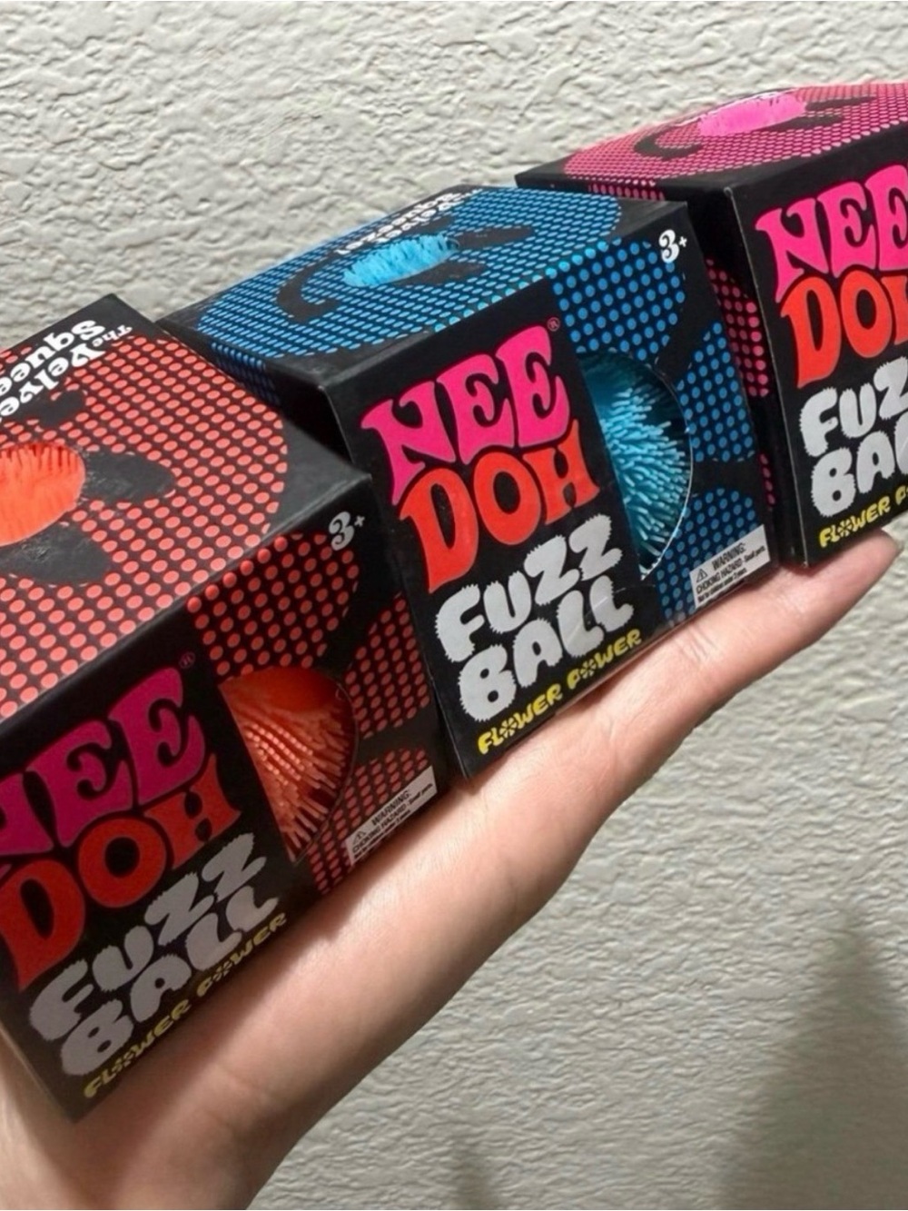 Bundle of 3 Needoh. Flower Power Fuzzy ball in Orange, Blue & Pink. NEW.